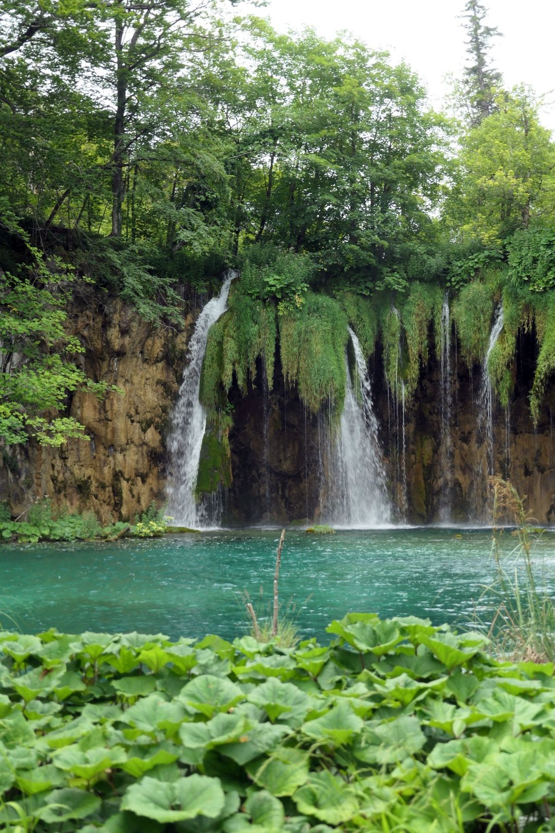 Cascades over an emerald lake, Plitvice