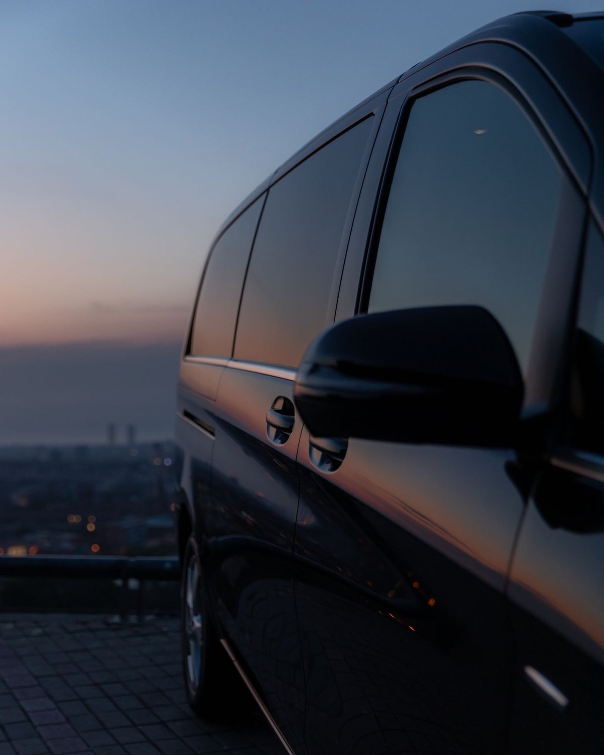 Mercedes-Benz V-Class at dusk above the coast